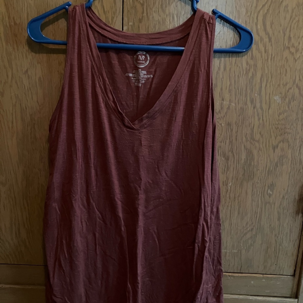 Maurice’s tank top.